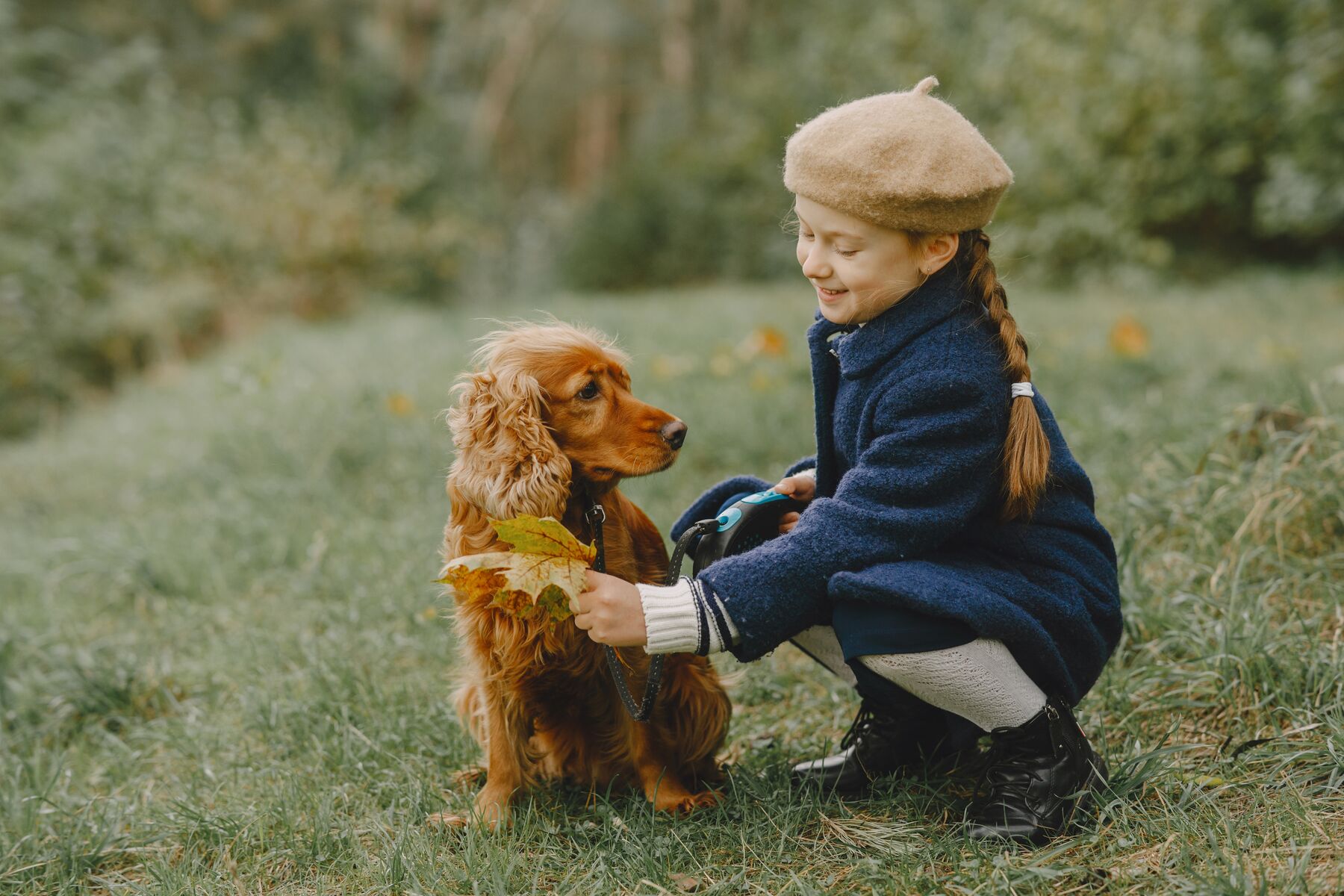 A woman and her dog by a fountain in Rome, Italy